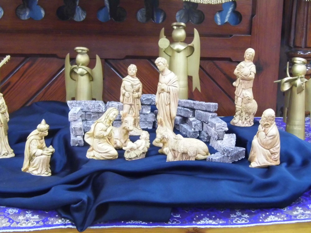 Handmade Moulded Crib Scene, surrounded by tall angels.